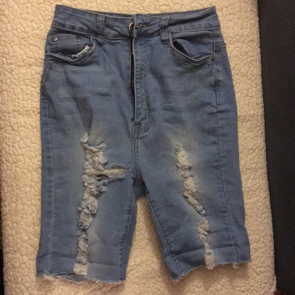 Light blue “ripped jean” shorts. High waisted.